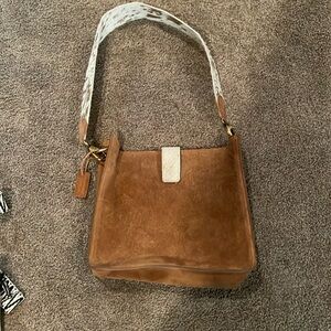 Brown purse with animal hair strap